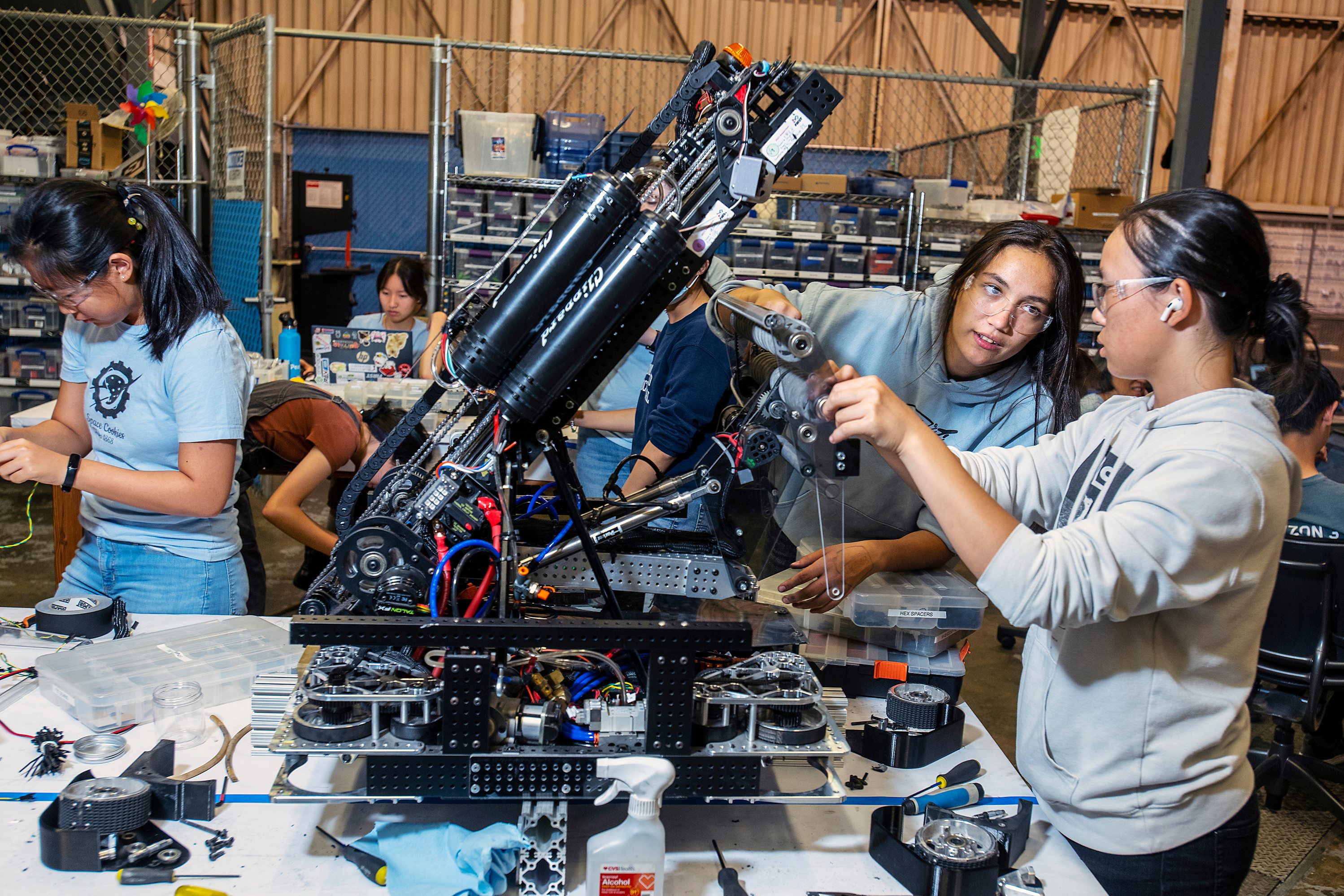Students working on a robot in a school robotics class